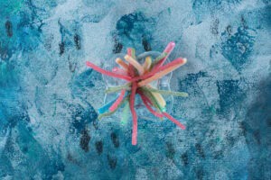 Colorful licorice candy in a glass, on the marble background | Foods that Lower Testosterone