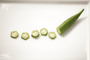 Chopped natural okra on ceramic plate | placeholder for okra water benefits