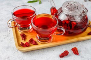 hibiscus tea in 2 cups and a jug | placeholder for hibiscus tea recipe