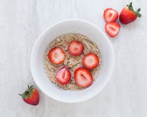 Strawberry on Table Top Near White Ceramic Bowl | placeholder for Oatzempic Diet