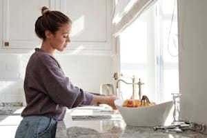 Woman Washing Fruits in the Sink | washing fruit with baking soda