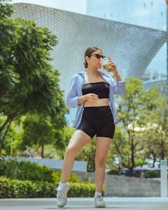 A Woman Wearing Sunglasses while Drinking Coffee | Burn Fat While Drinking Coffee