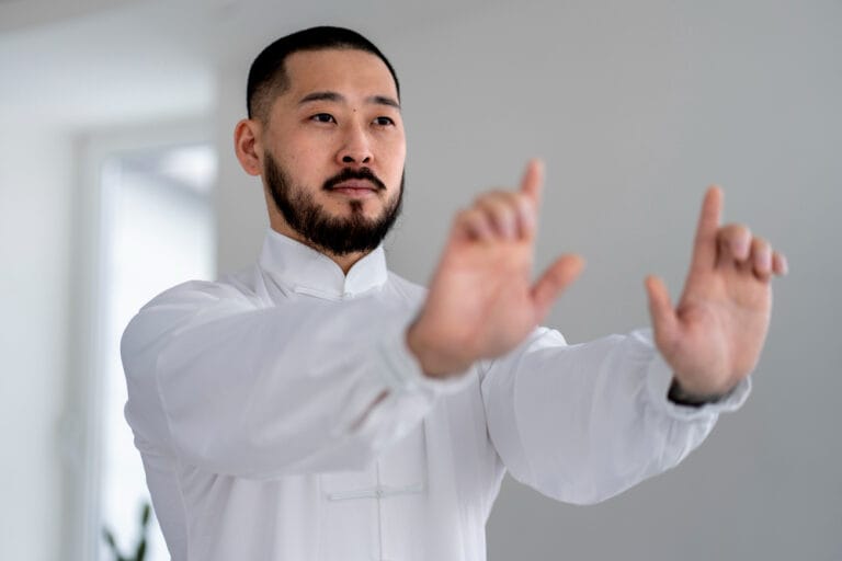 martial artist doing the horse stance | Over 40? These 5 Trainer-Approved Moves Will Keep You Strong and Mobile (Hint: Horse Stance Beats Planks)