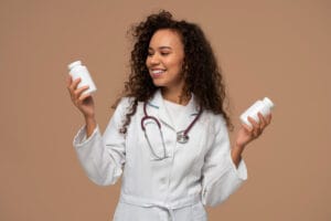 doctor with supplements | Stop the Bloat: 5 Gut-Boosting Supplements That Actually Relieve Constipation, According to a GI Doctor