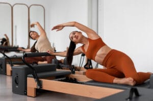 women doing a pilates routine | Crunches Hurt My Neck—This Pilates Routine Gave Me a Stronger Core Pain-Free
