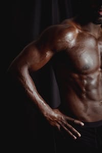 Close-up of a muscular, shirtless male torso highlighting strength and fitness. | STOP Wasting Time! An Exercise Scientist's Top 5 Exercises for EXPLOSIVE Muscle Growth (Seriously, That's It!)