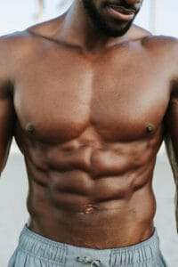 close up of man with abs | Old-School Strongmen Used This One Exercise to Carve Abs—Still Works Like Magic | Saxon Side bend