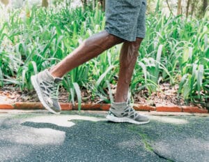 man jogging | I’ve Been Walking With a Weighted Vest for Months—Here’s How It's Worked for Me