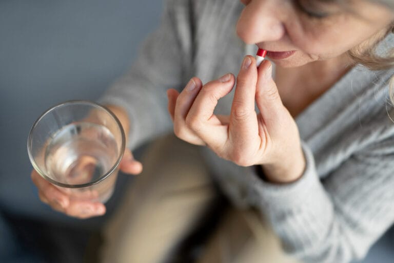 matured woman taking a supplement | STOP Menopause Misery: Dieticians Reveal 4 "Game-Changer" Supplements for Rapid Symptom Relief!