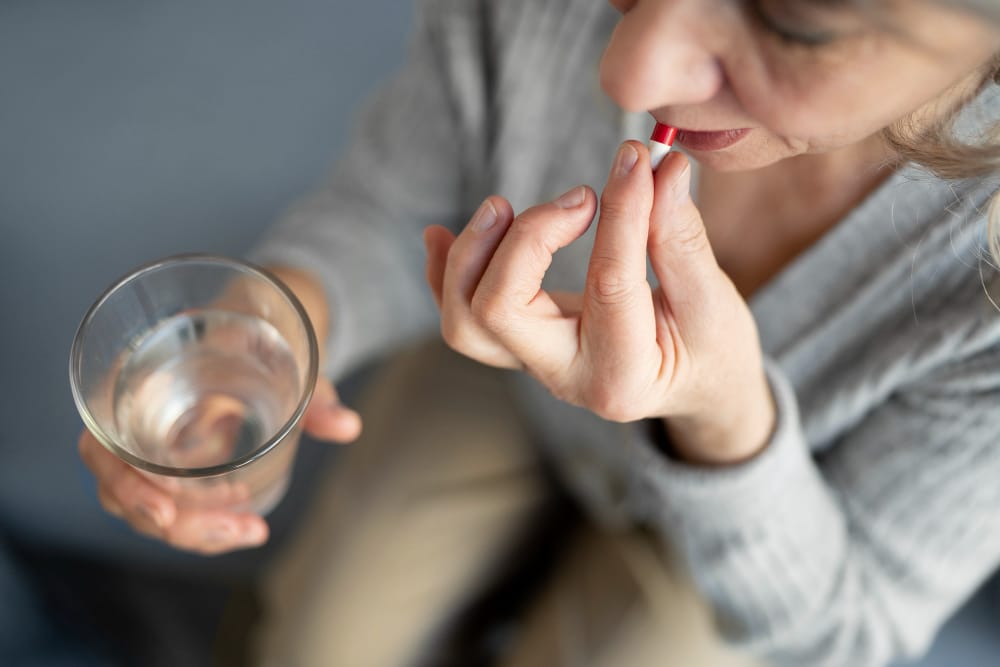 matured woman taking a supplement | STOP Menopause Misery: Dieticians Reveal 4 "Game-Changer" Supplements for Rapid Symptom Relief!