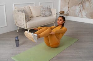 woman training on mat | These 5 Physical Therapist-Approved Exercises Fixed 95% of My Aches—Now I Do Them Every Day