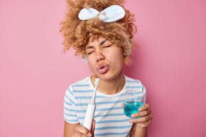 woman using mouthwash | URGENT WARNING: Stop Using THIS Mouthwash Now to Slash Your Bowel Cancer Risk (Surgeon's Shocking Discovery)