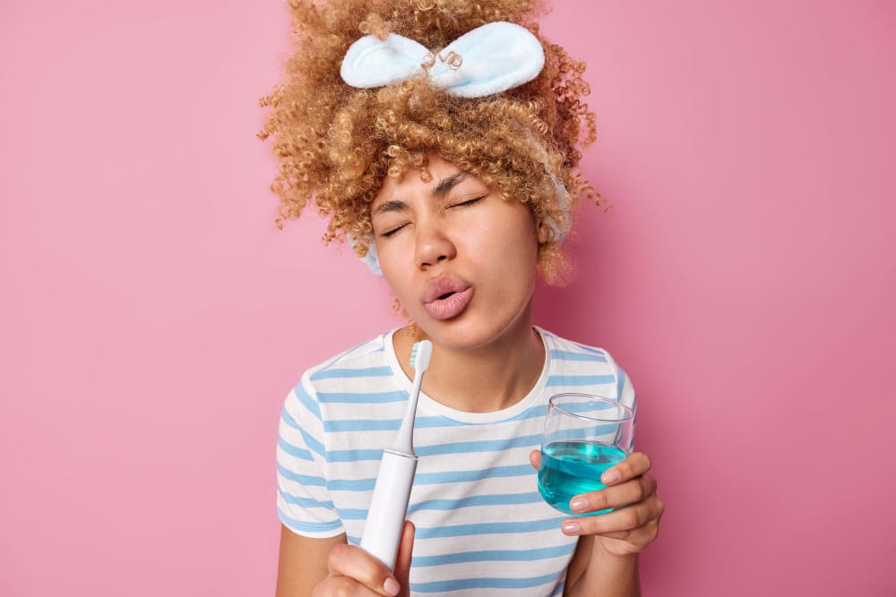 woman using mouthwash | URGENT WARNING: Stop Using THIS Mouthwash Now to Slash Your Bowel Cancer Risk (Surgeon's Shocking Discovery)