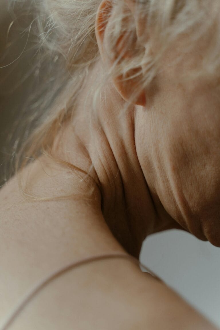 Detailed view of an elderly woman's neck, showcasing aging skin and natural wrinkling. | Wrinkles & Dull Skin? A Doctor Reveals The #1 Inflammatory Food Aging You FAST