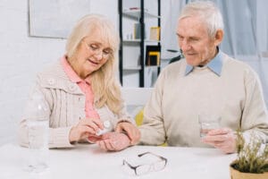 senior couple using pills | Your Daily Magnesium: Could It Slash Your Colon Cancer Risk? Doctors Weigh In!