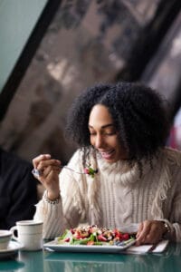 woman eating a fruit salad | Secret Weapons Against Cholesterol: 10 Foods That Clean Your Arteries & Balance Your Levels Naturally!