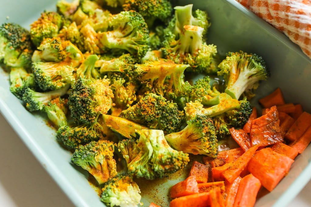 A delightful and vibrant roasted broccoli and carrots dish seasoned to perfection, ideal for health enthusiasts. | Reverse Prediabetes: A Dietitian's 5 Must-Eat Foods for Stable Blood Sugar