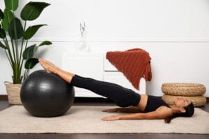 woman doing a Swiss Ball Leg Curl