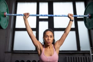 fit woman lifting barbell | These Women Over 60 Got Stronger, Healthier, and Happier—Thanks to Lifting Weights