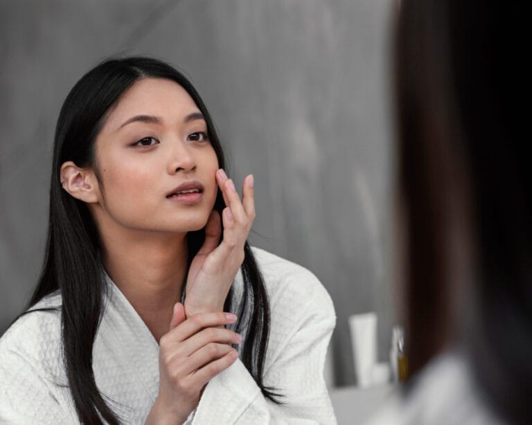 korean woman doing skincare | The Korean Skincare Product That’s Quietly Becoming a Dermatologist Favorite