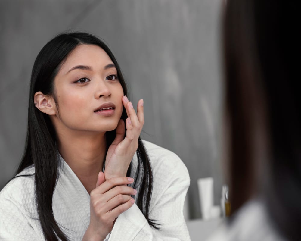 korean woman doing skincare | The Korean Skincare Product That’s Quietly Becoming a Dermatologist Favorite