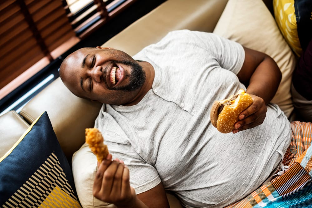 man eating a hamburger
