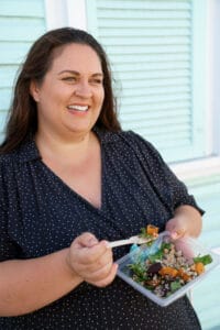 woman eating a salad | Your “Healthy” Salad Is Sabotaging Your Weight Loss (The One Hidden Ingredient)