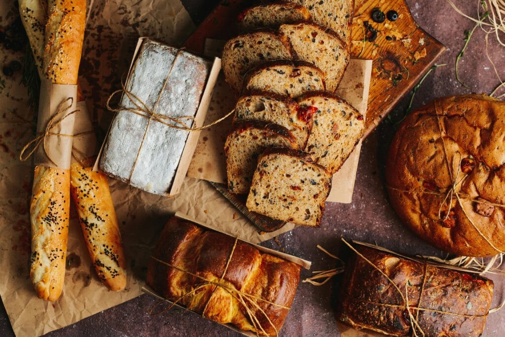 A beautifully arranged variety of freshly baked breads and baguettes, perfect for food lovers.