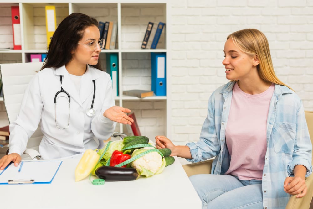 doctor talking to patient about vegetables