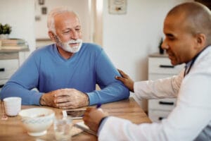 doctor talking to senior patient