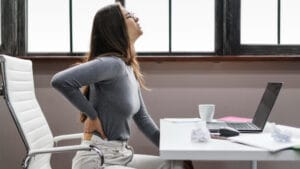 woman with back pain from sitting