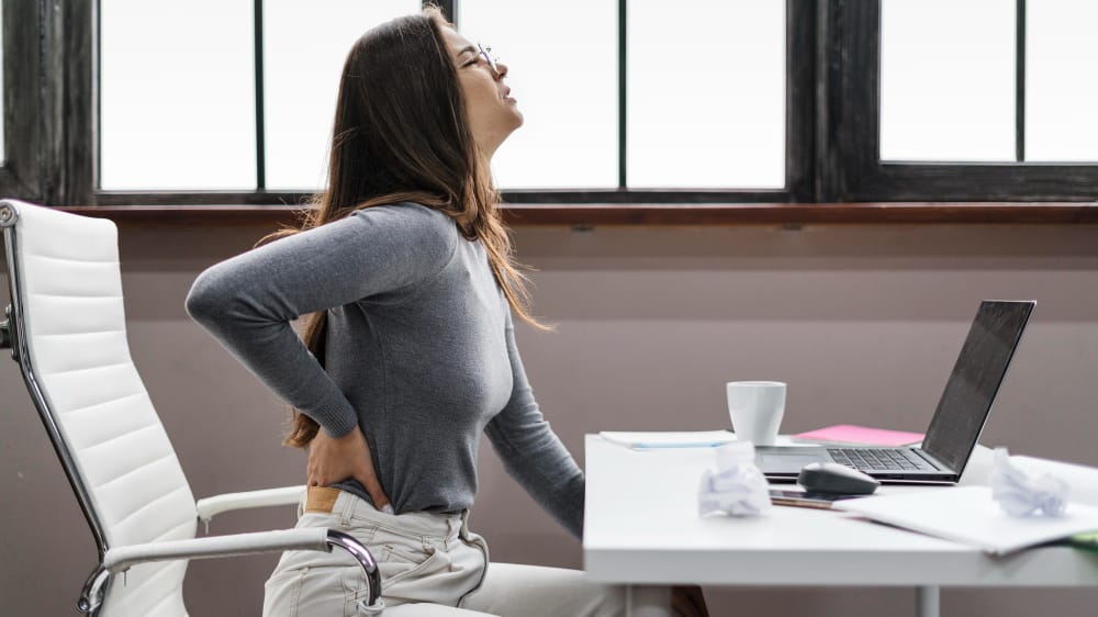 woman with back pain from sitting