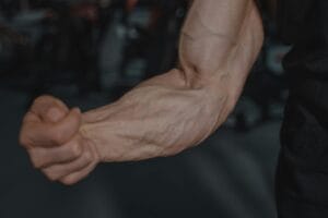 Detailed image of a flexed arm showing prominent veins and muscular definition.