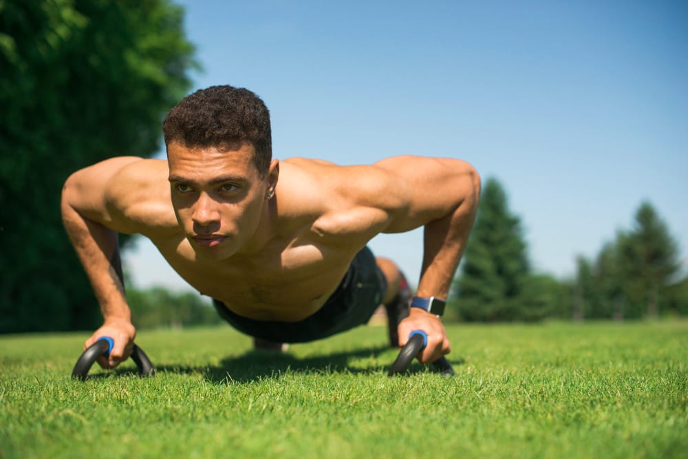 ripped man doing pushups
