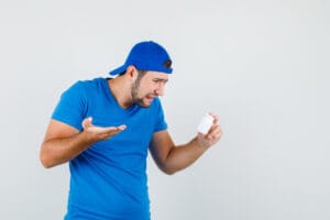 man holding bad supplement or pills