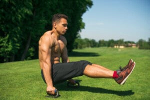 shirtless fit man training outdoors