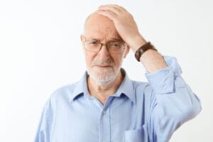 elderly man with a migraine | memory loss
