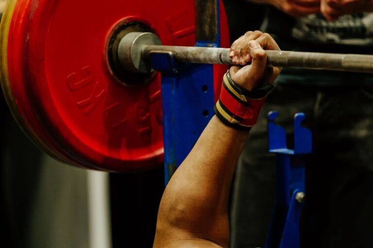 strong man gripping a barbell